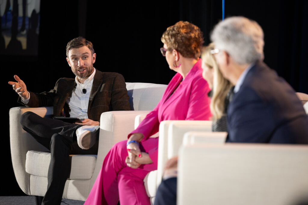 Andrew moderating a panel at the Livelong Summit in Florida, USA